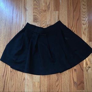 Black pleated mini skirt